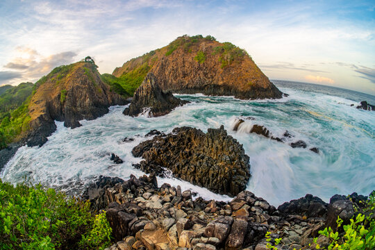 dramatic coastal scene  with rocky cliffs and waves