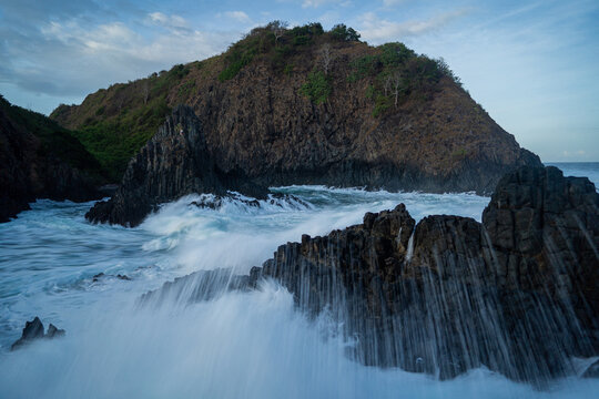 dramatic coastal scene  with rocky cliffs and waves