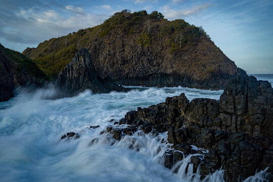 dramatic coastal scene  with rocky cliffs and waves