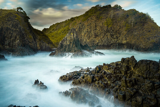 dramatic coastal scene  with rocky cliffs and waves