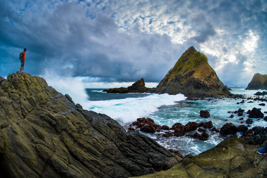 dramatic coastal scene  with rocky cliffs and waves