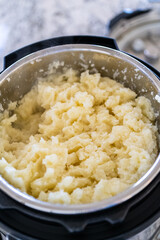 Whipping Up Creamy Mashed Potatoes in Modern Kitchen