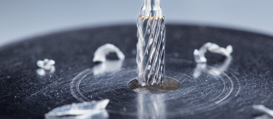 Milling cutter make sink in hole in steel billet. Locksmith work.