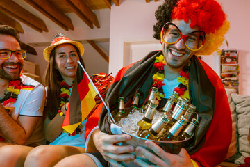 Group of enthusiastic German soccer fans celebrating the victory