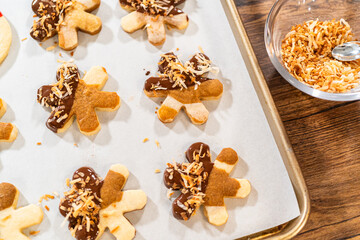 Chocolate-Dipped Gingerbread Men with Golden Toasted Coconut