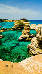 Lo spettacolare scenario dei faraglioni di Sant'Andrea, Torre Sant'Andrea,...