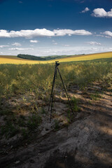 Attributes of a photographer in the field. A tripod is the main tool of a landscape photographer.
