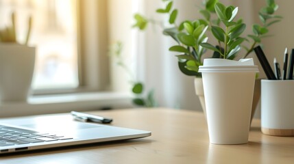Fototapeta premium white paper cup mockup, minimalistic home office desk with blank coffee cup and laptop