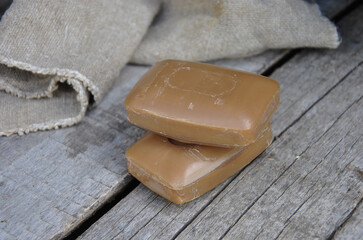 tar soap on a wooden old table. selective focus