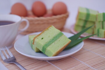 pandan cake and egg on white plate. Selective focus.