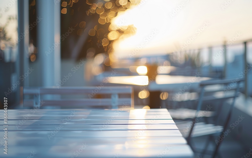Poster bright summer day at coastal cafe with empty white wooden table, bokeh background
