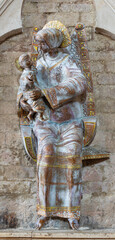 ASSISI, ITALY - MAY 17, 2024:  The ceramic statue of Madonna in the church Chiesa di San Pietro by...