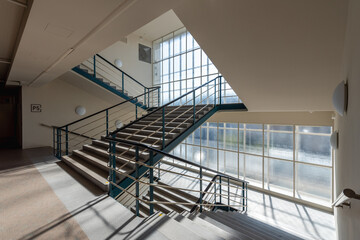 Functionalist building with reinforced concrete construction and creamy white cladding. The...