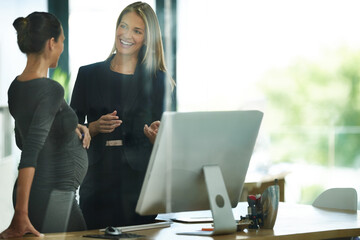 Business, teamwork and pregnant woman at desk with computer, discussion and planning at digital...