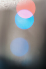 Close up unfocused of lights of colors in the shape of circles of colors blue and orange