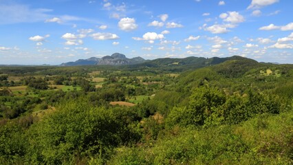 Obraz premium Landscape with green hills and blue sky