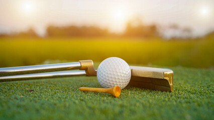 Close up of golf equipment on green grass.