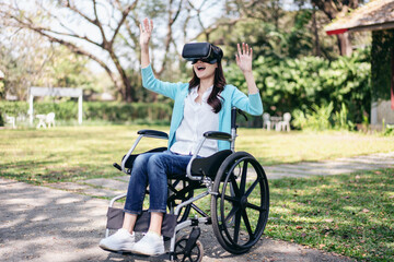 Woman on wheelchair concept, Young asian woman on wheelchair using VR headset to playing games