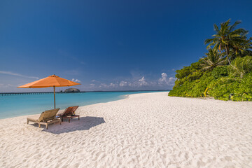 Beautiful panoramic sea sand sky. Tropical relax beach sunny summer island landscape. Love couple chairs umbrella palm leaves romantic coast. Luxury travel destination. Honeymoon vacation best tourism