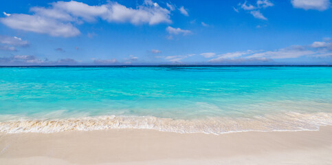 Closeup sandy beach, sunny blue sea sky. Panoramic beach landscape. Empty tropical beachfront and seascape copy space. White soft sand texture, calmness tranquil relaxing sunlight, summer tourism mood