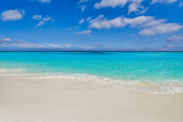 Closeup sandy beach, sunny blue sea sky. Panoramic beach landscape. Empty tropical beachfront and seascape copy space. White soft sand texture, calmness tranquil relaxing sunlight, summer tourism mood