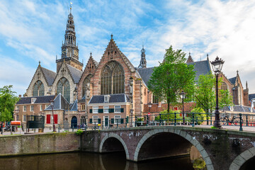 Naklejka premium Oude Kerk, old church, is the oldest building of Amsterdam in Dutch