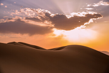 Sunset in the Gobi desert. Color show at the singing dunes of Khongoryn Els