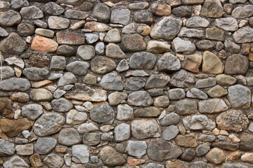 Stone wall in an old abandoned and ruined house