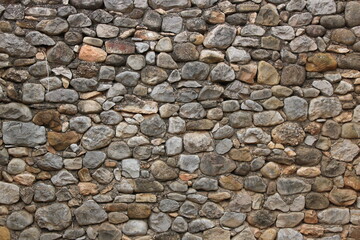 Stone wall in an old abandoned and ruined house