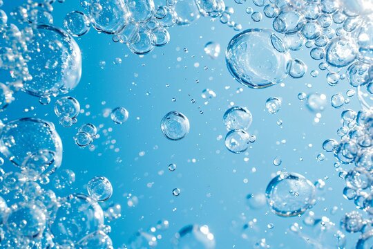 White soap foam with bubbles texture on blue background. Detergent foam bubble on water, soap sud. Face cleansing mousse smudge, shower gel, hair shampoo foam smear texture. Beauty, clean and laundry 