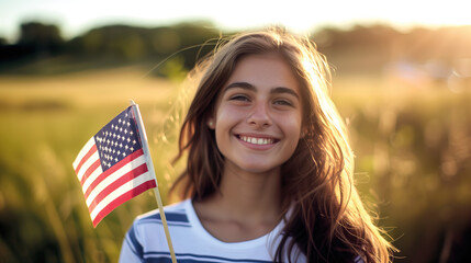 Young woman holding American flag at sunset. America celebrate 4th of July, Independence Day, Presidents' Day.