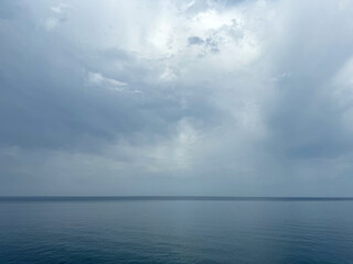 Calm sea in foggy cloudy weather