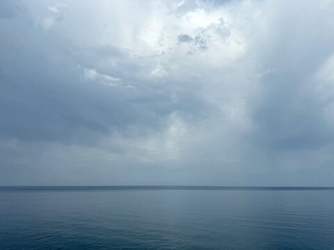 Calm sea in foggy cloudy weather