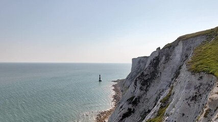 Beachy Head Lighthouse, south England, cliffs, chalk, ocean, coast line, erosion, turquoise water, drone, Sussex, English Channel, rock tower, nature, walking trail, areal view, drone  - Powered by Adobe