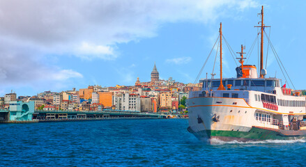 Obraz premium Sea voyage with old ferry (steamboat) in the Bosporus - Galata Tower, Galata Bridge, Karakoy district and Golden Horn, istanbul 