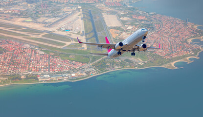 Commerical passenger plane fly up over take-off runway from airport - Istanbul, Turkey