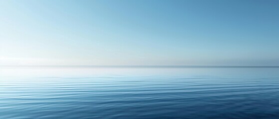 Obraz premium The image is of a calm, blue ocean with no visible waves