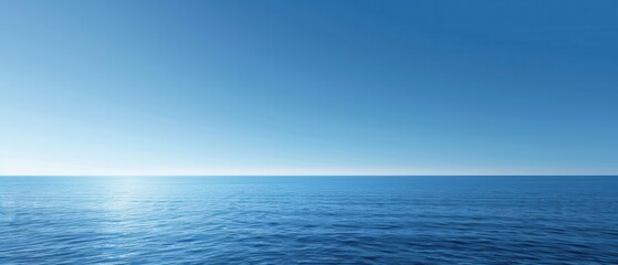 Obraz premium The ocean is calm and blue, with no clouds in the sky