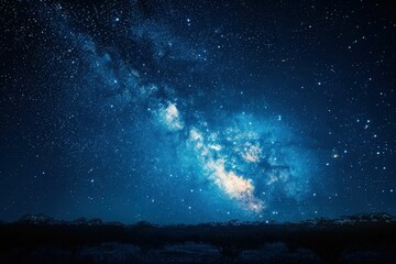 Fototapeta premium Stunning Night Sky with Milky Way Galaxy Over a Dark Landscape in a Clear Starry Night