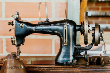 Antique sewing machine displayed in a Colombian restaurant, culture, travel and customs. Textile, fashion and vintage.