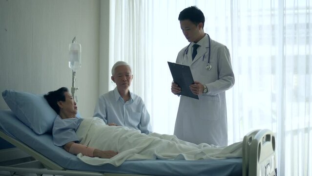 Asian senior admit in hospital accident hurt doctor come round checking couple worry
