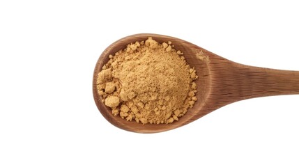 A wooden spoon filled with brown powder on a white surface