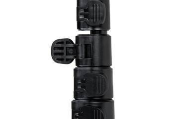 Black mini tripod for compact camera isolated on white back