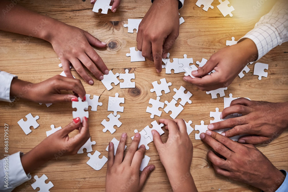 Aufkleber Above, hands and business people with puzzle in table for problem solving, inclusion and strategy. Employees, partnership and collaboration for innovation or solution with team building and support