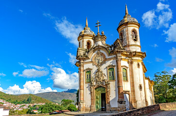 Frontal view of historic baroque church lit by the sun in the famous city of Ouro Preto in Minas Gerais