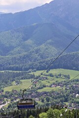 cable car, ski lift in the mountains, mountain views, chairs on the ski lift