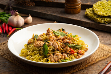 Spicy stir fried instant vegetable noodle or japanese style Jade noodles with minced pork and thai...
