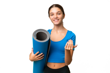 Teenager caucasian girl going to yoga classes while holding a mat over isolated background inviting to come with hand. Happy that you came