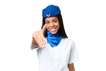 Airplane stewardess African american woman over isolated background shaking hands for closing a good deal