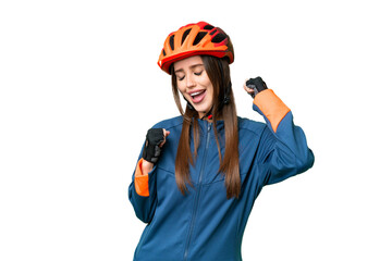 Young cyclist woman over isolated chroma key background celebrating a victory